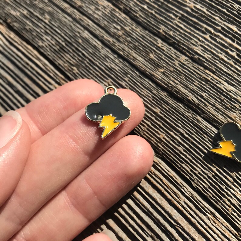Cute black and orange enamel and gold plated lightning bolt gloomy thunderstorm rain cloud charms pendants sold as a pack of 5