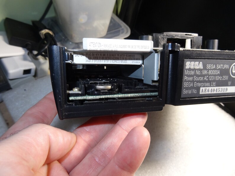 Sega Saturn Model MK-80000A Black Back Battery Cover with 5 Bottom Screws-Good-Clean-Exact one