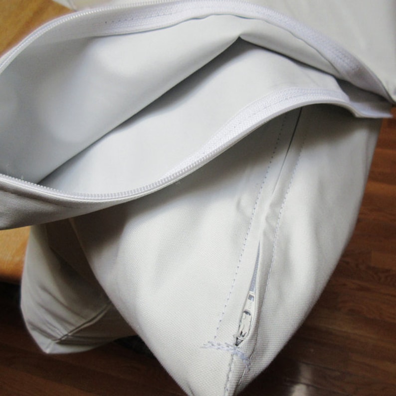 Pesky down feather pillow andor cushion protectors with zipper enclosures